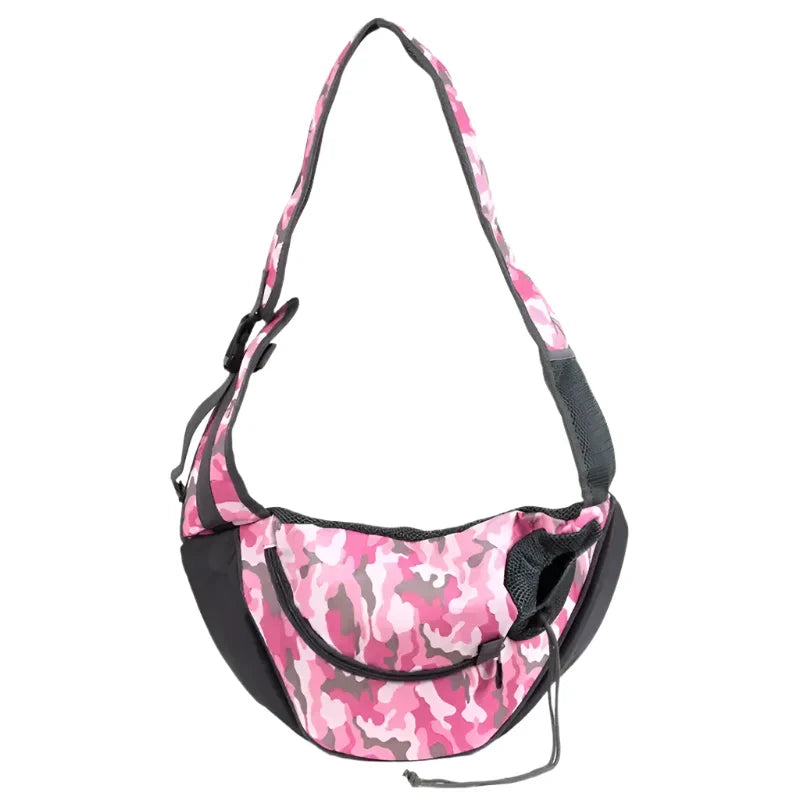 Pink camouflage-patterned shoulder bag with a curved shape and adjustable strap.