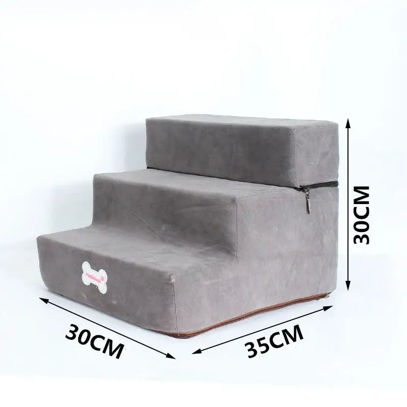 Pet stairs with three steps covered in gray fabric, featuring a small bone-shaped design.