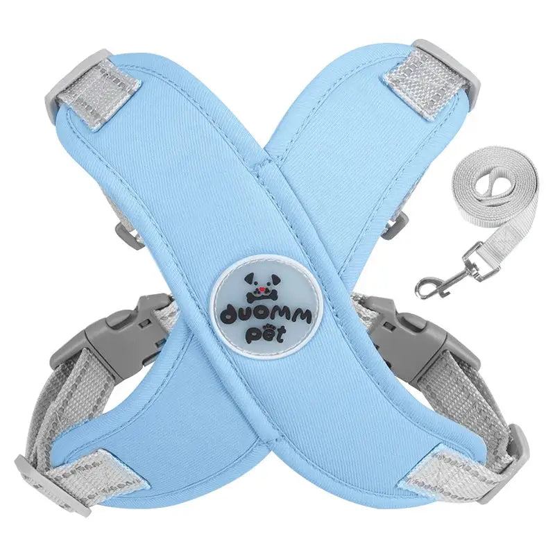 Light blue dog harness with adjustable straps and a paw print logo.