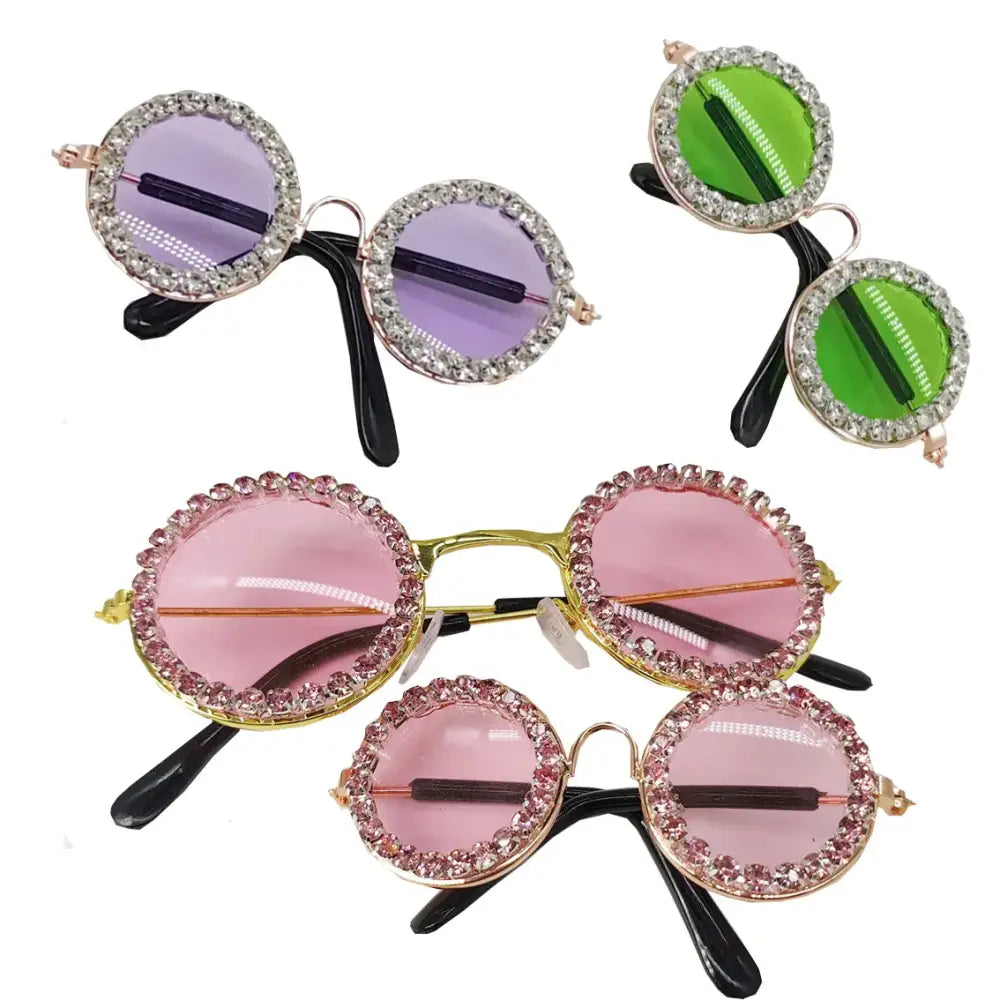 Colorful round sunglasses with rhinestone-encrusted frames in purple, green, and pink tints.