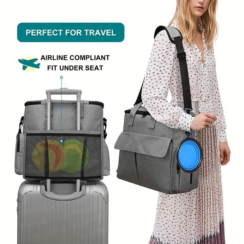 Travel bag designed to fit under airplane seats with multiple compartments and a luggage strap.