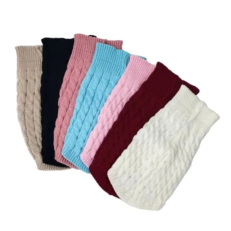 Assortment of knitted leg warmers in various colors and patterns.