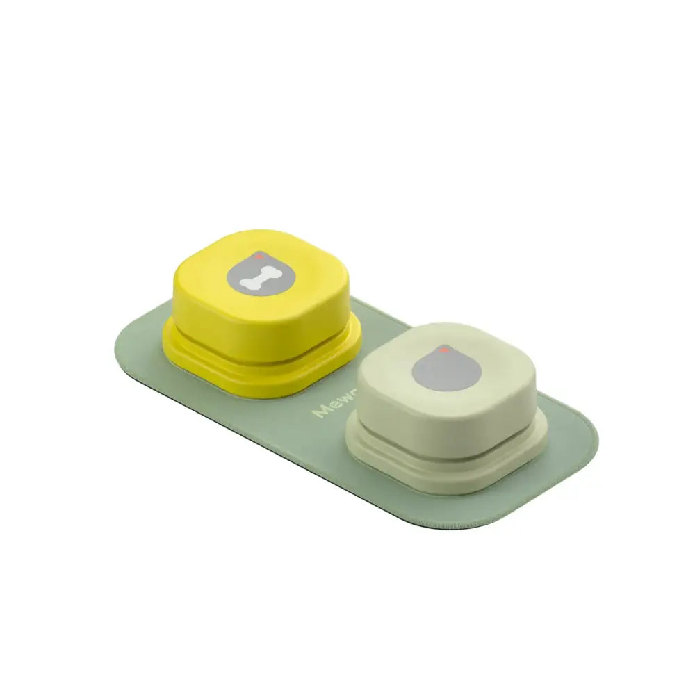 Two hexagonal contact lens cases, one yellow and one off-white, attached to a pale green base.