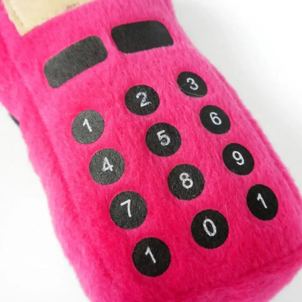 Bright pink plush calculator with black number buttons.