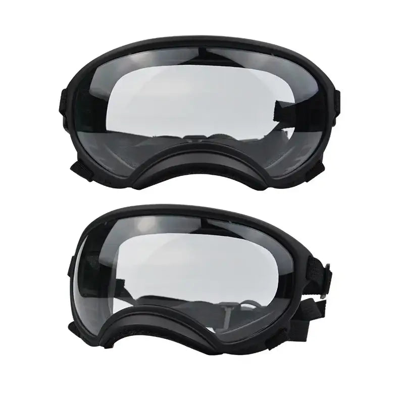 Pair of black-framed safety goggles or protective eyewear with clear lenses.