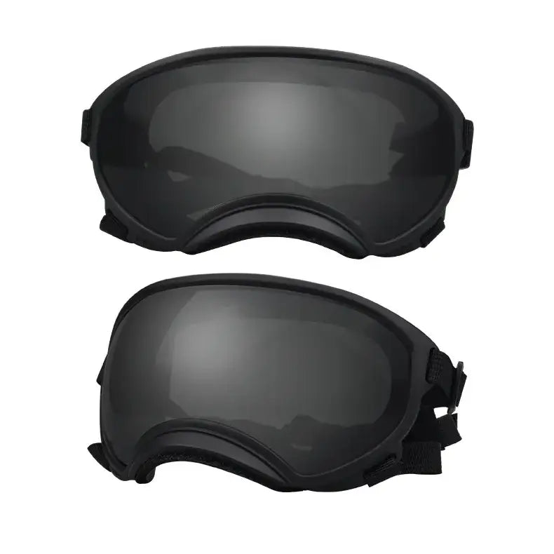 Pair of black ski or snowboard goggles with tinted lenses.