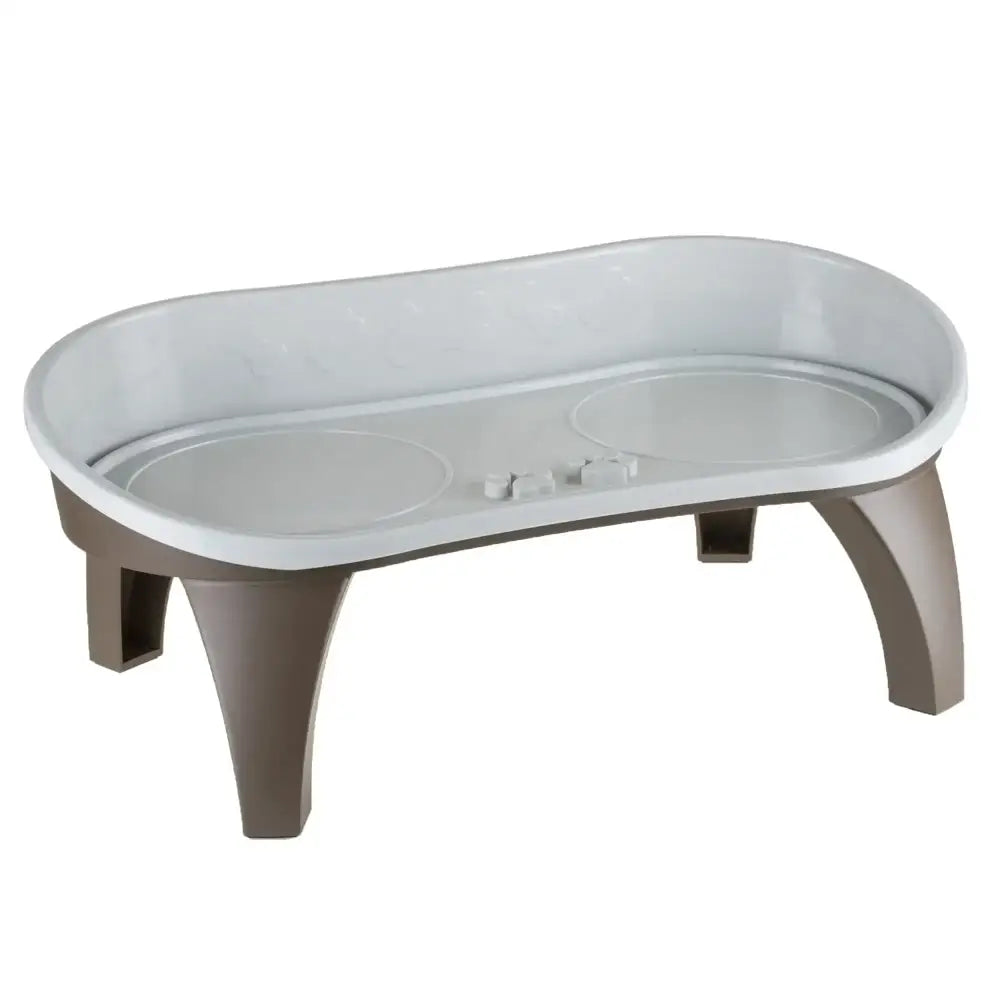 Elevated pet feeding bowl with a shallow, oval-shaped dish and four sturdy legs.