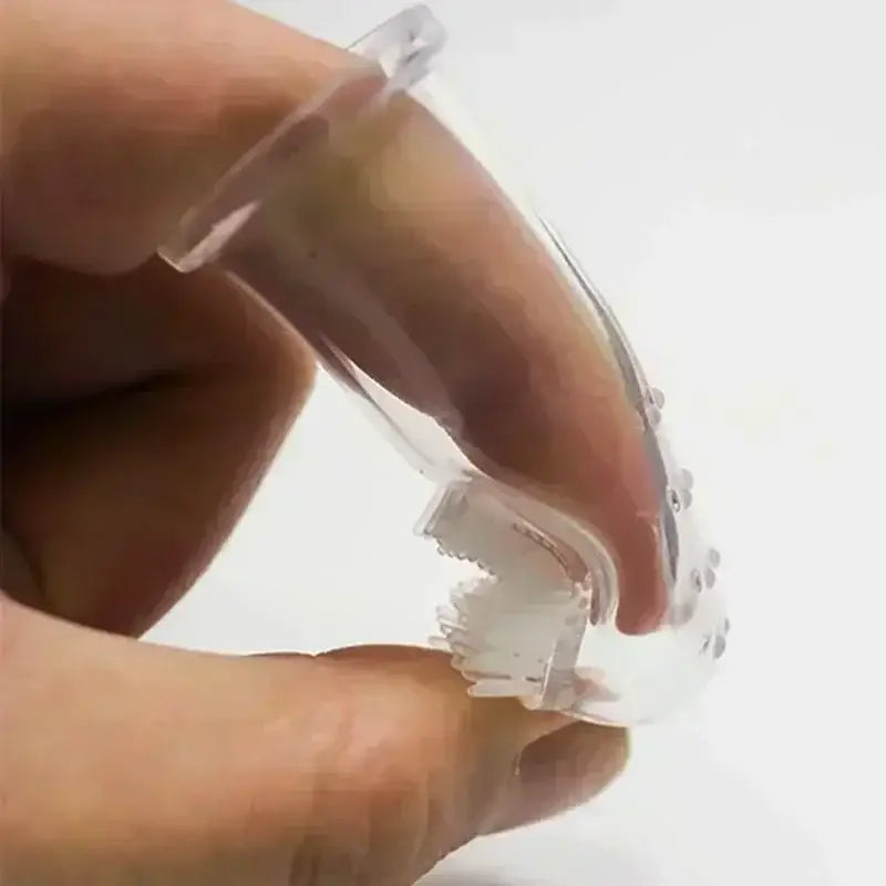 Clear plastic retainer or aligner being held between fingers.