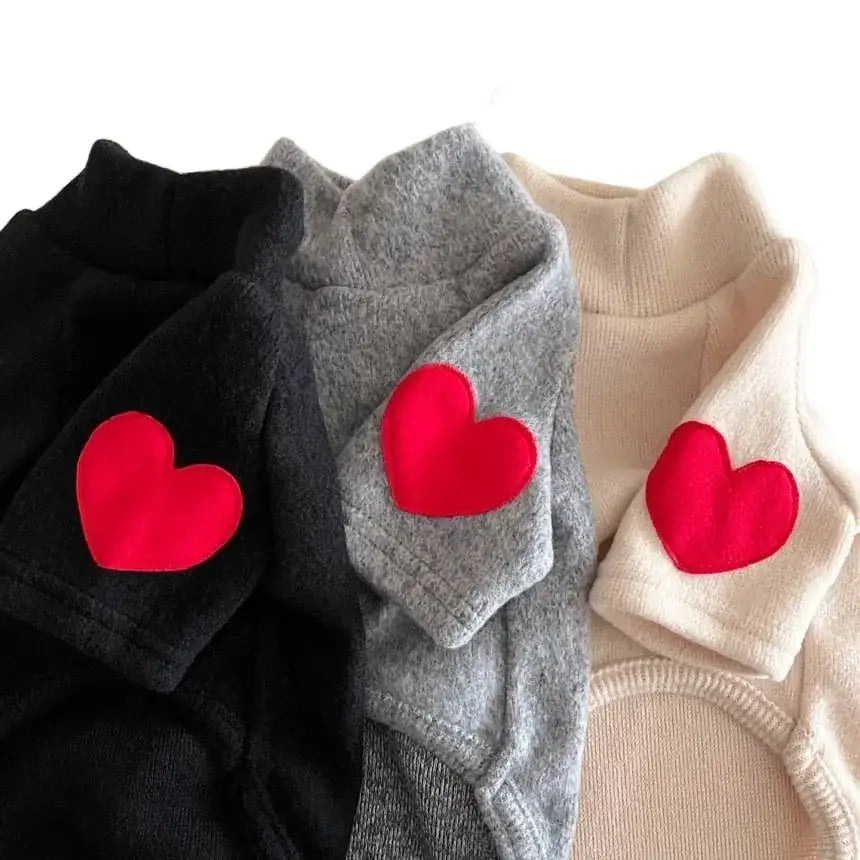 Sweaters with red heart patches on the sleeves.