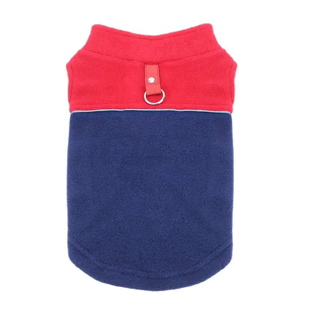 Dog vest with red top and navy blue bottom, featuring a metal ring attachment.