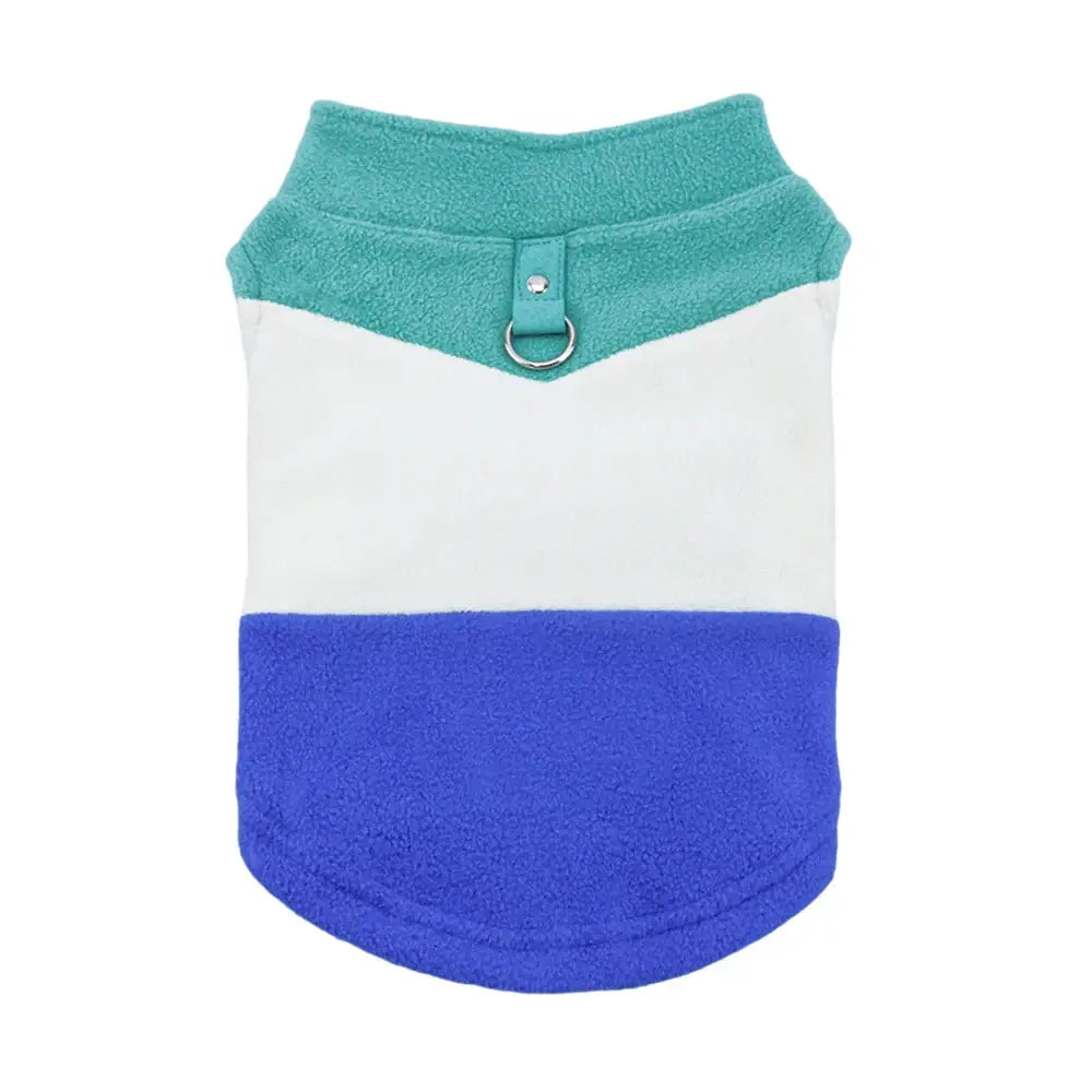 Tricolor pet vest with teal, white, and blue sections and a metal D-ring attachment.