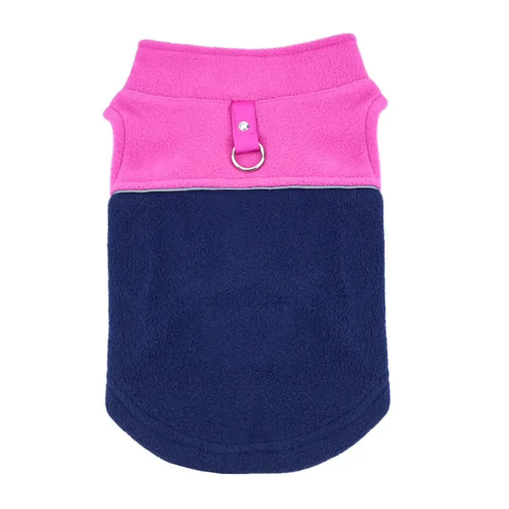 Two-toned dog vest with a pink upper portion and navy blue lower portion, featuring a metal D-ring attachment.