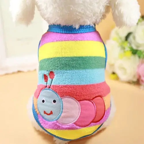 Colorful striped pet sweater with a smiling caterpillar applique.