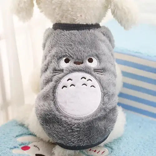 Plush toy or costume resembling Totoro, a character from Studio Ghibli films.