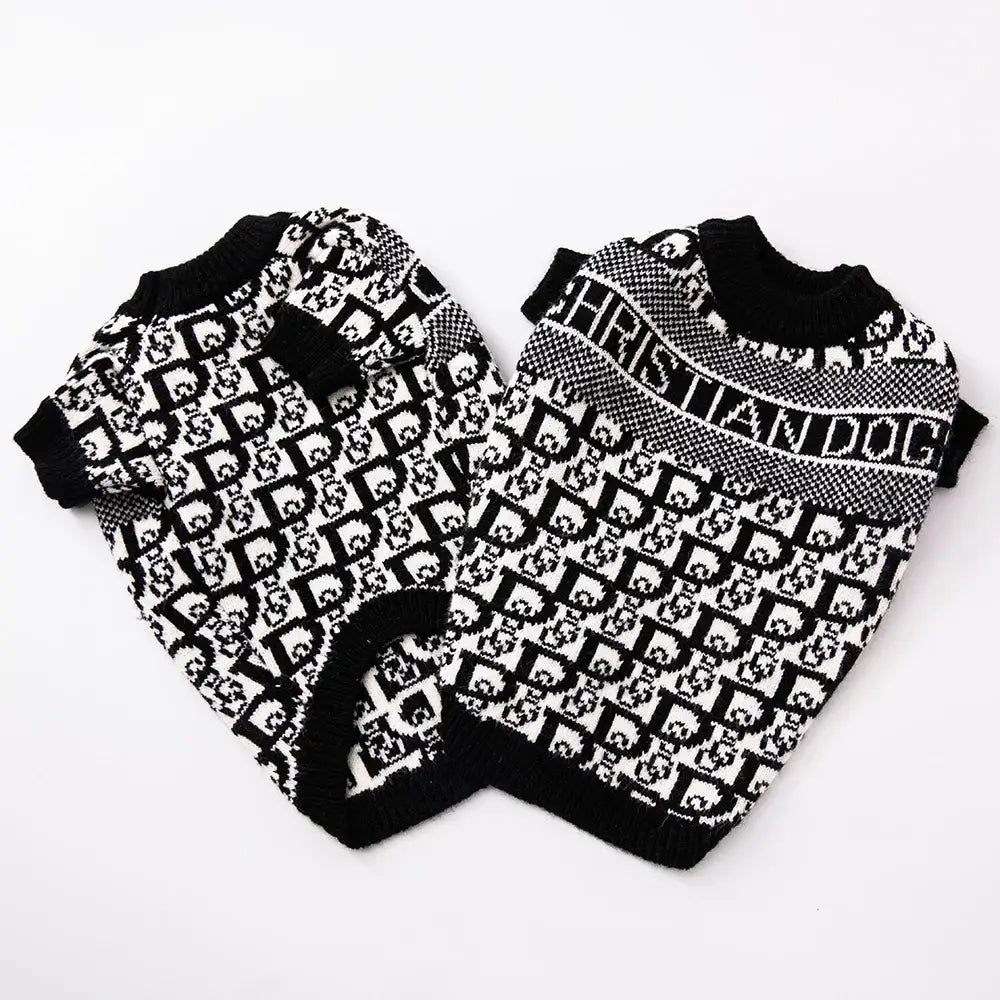 Two black and white patterned dog sweaters with ’Christian Dior’ branding.