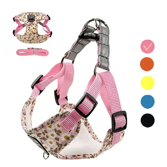 Dog harness with a floral pattern and pink straps.