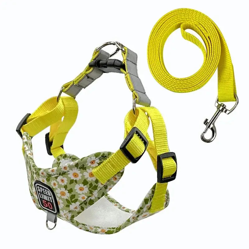 Dog harness with a floral pattern and bright yellow straps, accompanied by a matching leash.