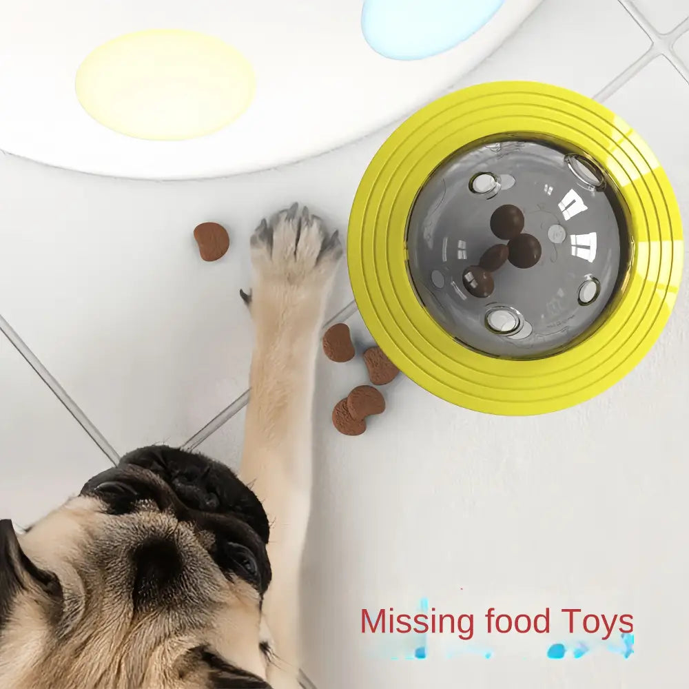 Dog reaching for a yellow food puzzle toy.