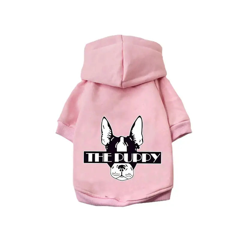 Pink dog hoodie with a cartoon dog face and ’THE PUPPY’ text printed on it.