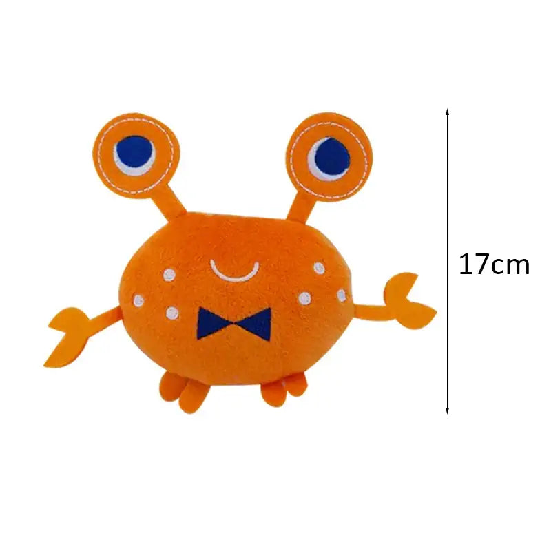 Cute orange cartoon crab plush toy with blue eyes and a bowtie.