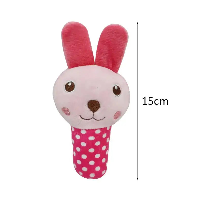 Cute pink rabbit-shaped baby rattle toy with polka dot handle.