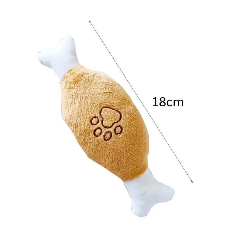 Plush dog toy shaped like a chicken drumstick with paw print design.