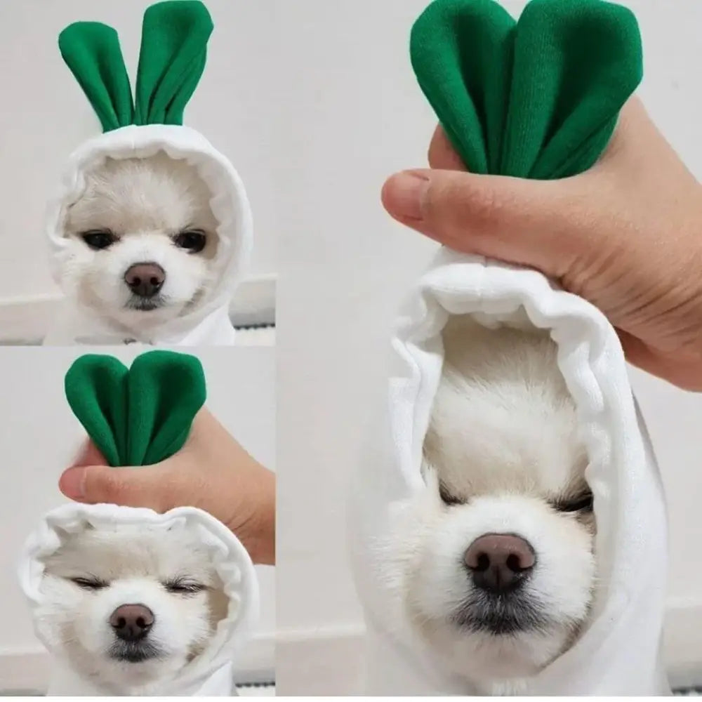 White dog wearing a green bunny ear costume.