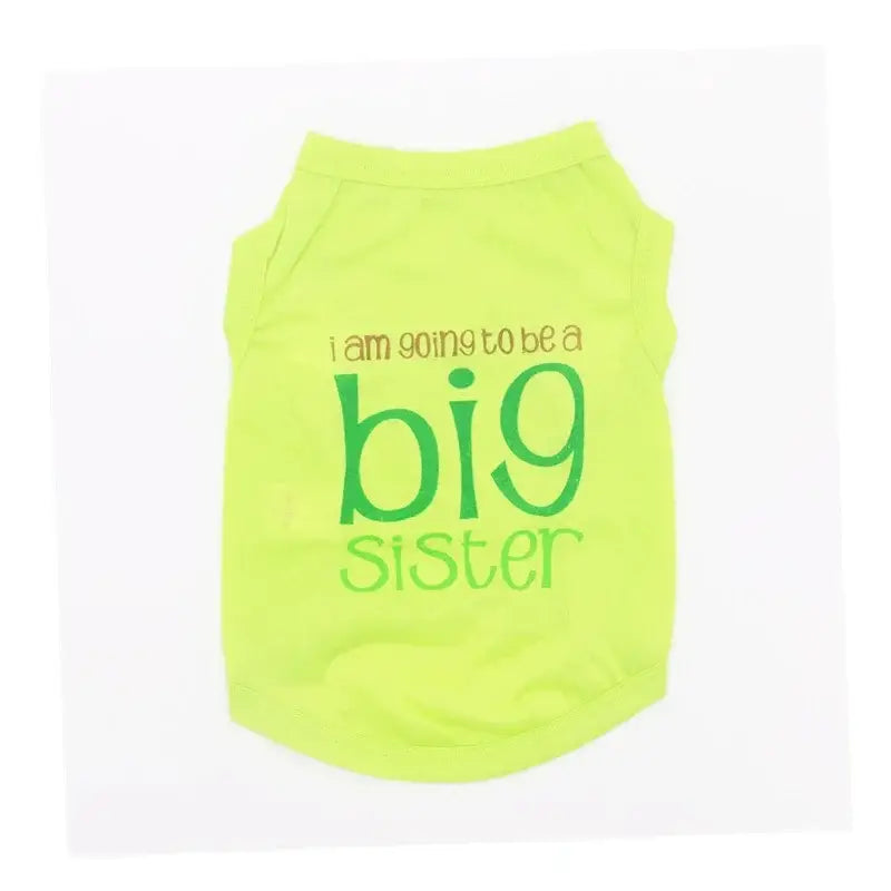 Bright neon yellow dog shirt with ’I am going to be a big sister’ text printed on it.