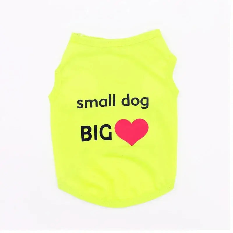 Neon yellow dog shirt with ’small dog BIG ❤️’ text printed on it.