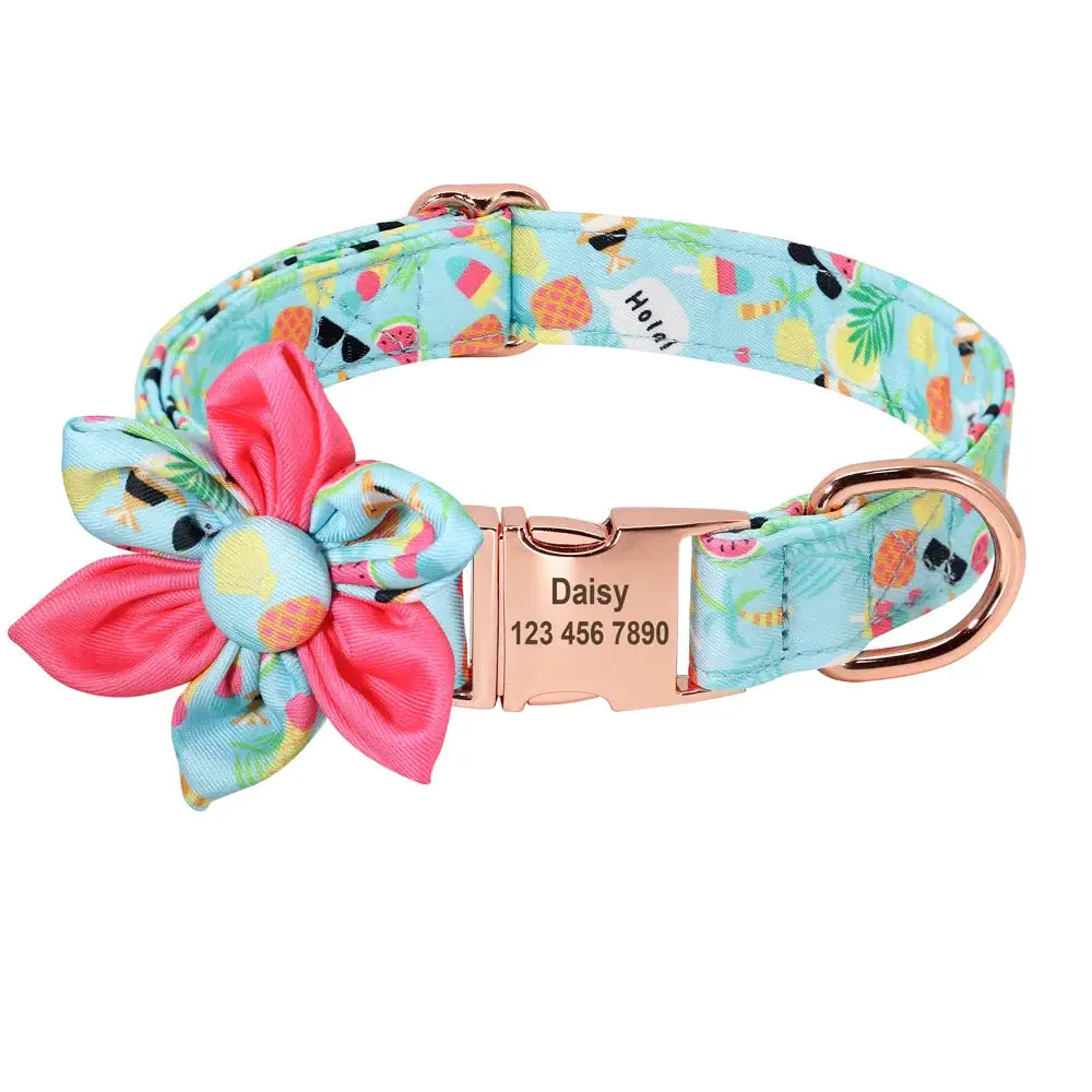 Colorful dog collar with a floral pattern and a pink flower decoration.