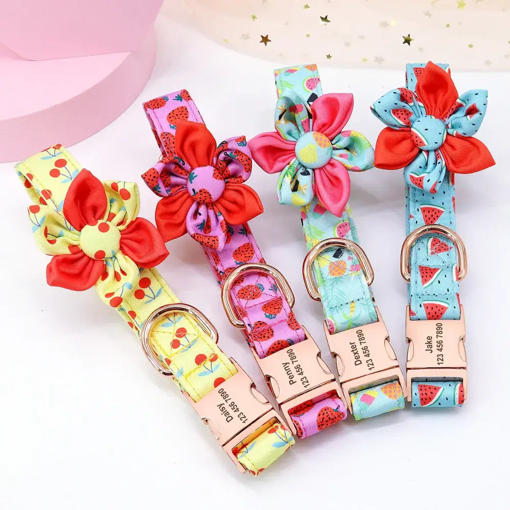 Colorful floral-patterned dog collars with fabric flower decorations.