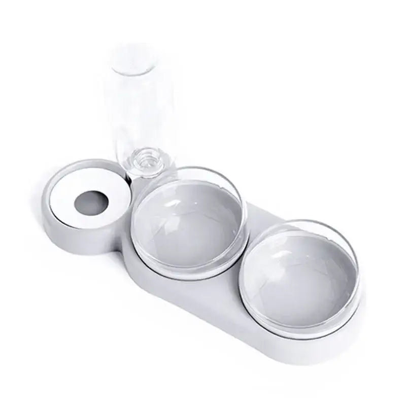 White ceramic serving tray with two bowls and a glass bottle.