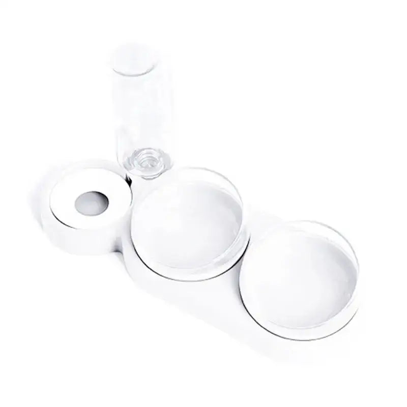 White tableware set consisting of plates, a glass, and a roll of toilet paper.