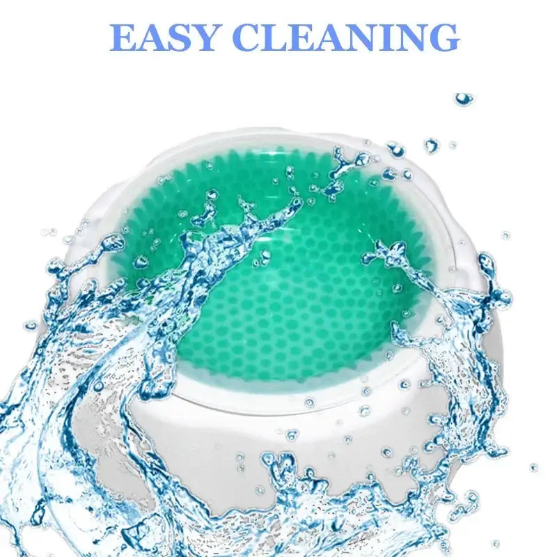 Circular green cleaning pad surrounded by splashing water.