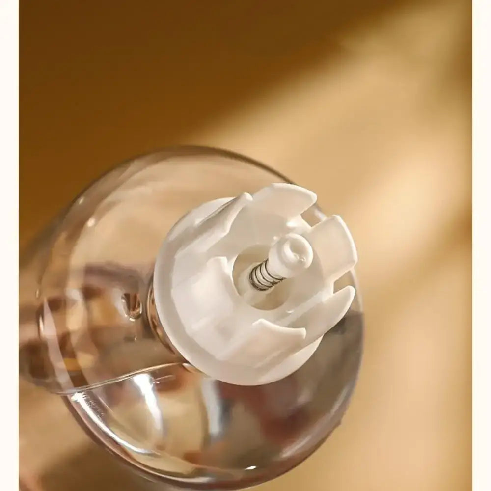 Light bulb with a frosted glass spiral-shaped element inside a clear glass globe.