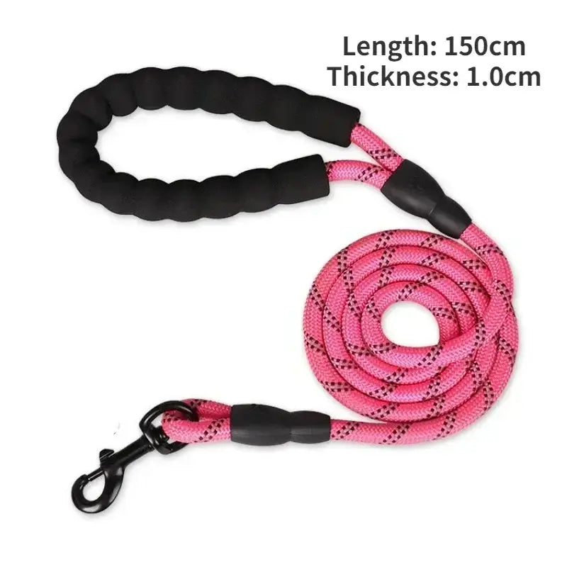 Dog leash with a braided black handle and pink rope section.