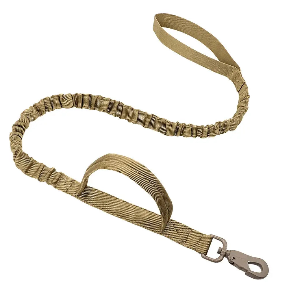 Tactical bungee dog leash in tan or khaki color with a handle and metal clip.