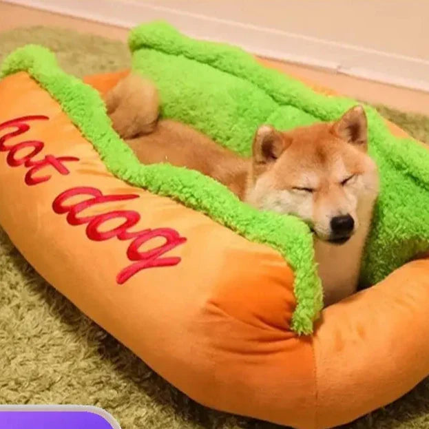 Dog-shaped hot dog bed with a plush Shiba Inu nestled inside.