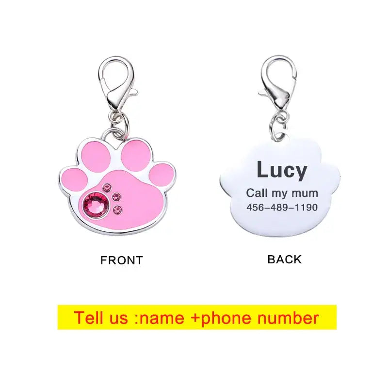 Pet ID tag with a pink paw print design on the front and customizable contact information on the back.