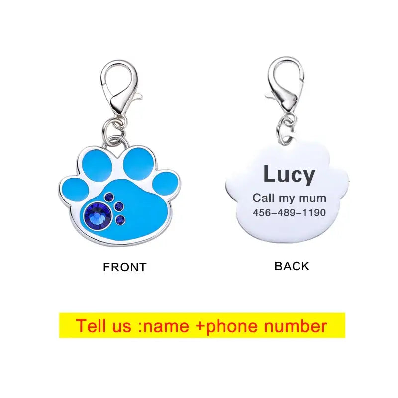 Pet identification tag with a blue paw print design on the front and personalized information on the back.