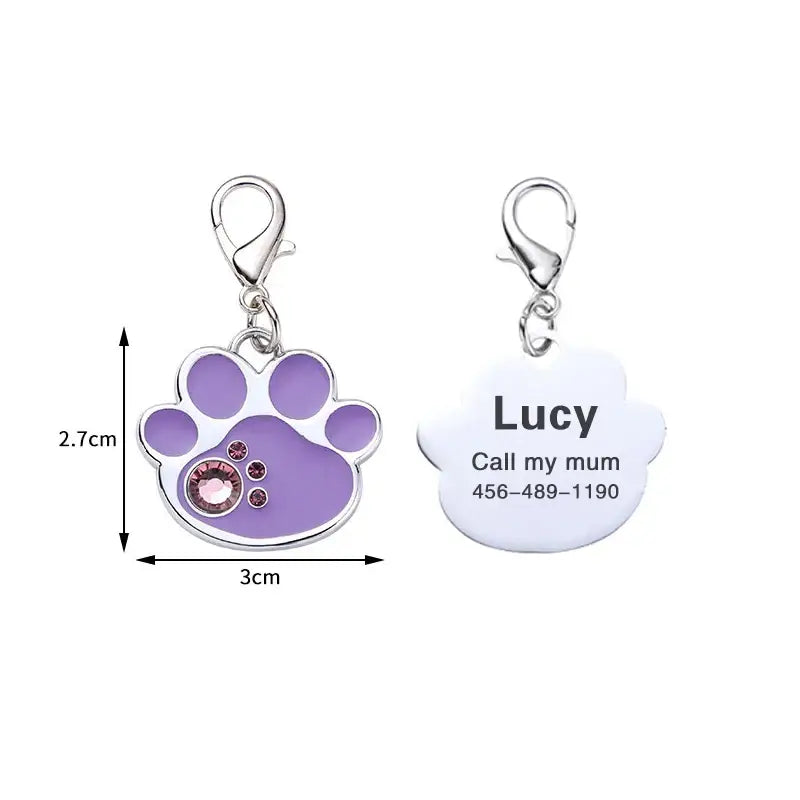 Pet identification tag with a purple paw print design and customizable information.