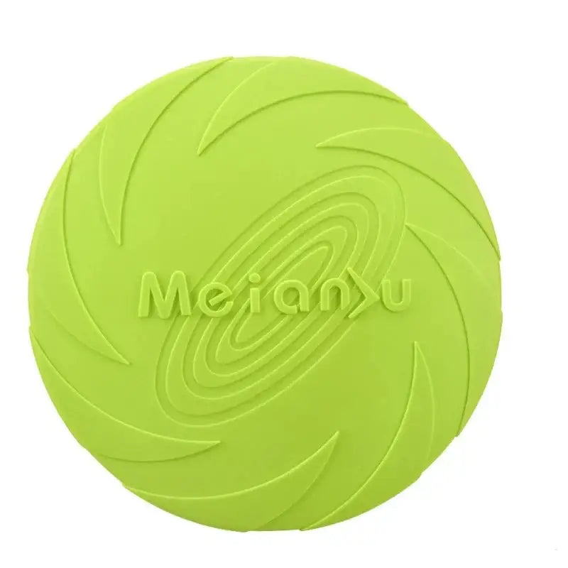 Bright green circular frisbee-like toy with ’Meranx’ embossed on its surface and a swirled pattern design.