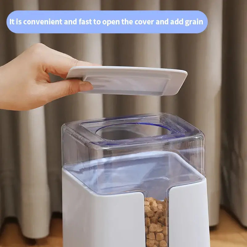 Pet food dispenser with a transparent container and removable lid.