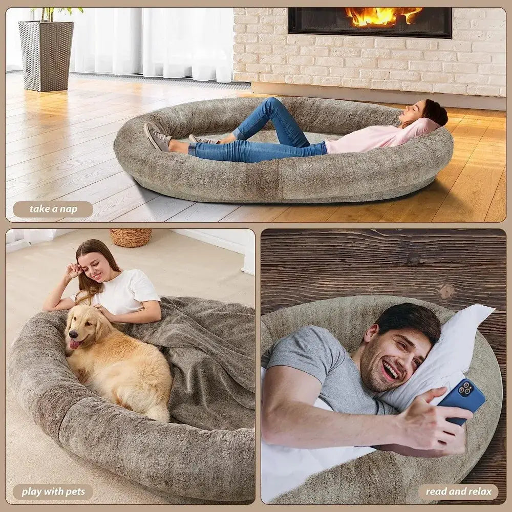 Circular, plush, cushioned lounger or bed with raised edges.