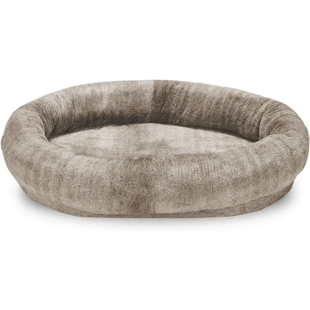 Circular plush pet bed with raised edges in a light grayish-brown color.