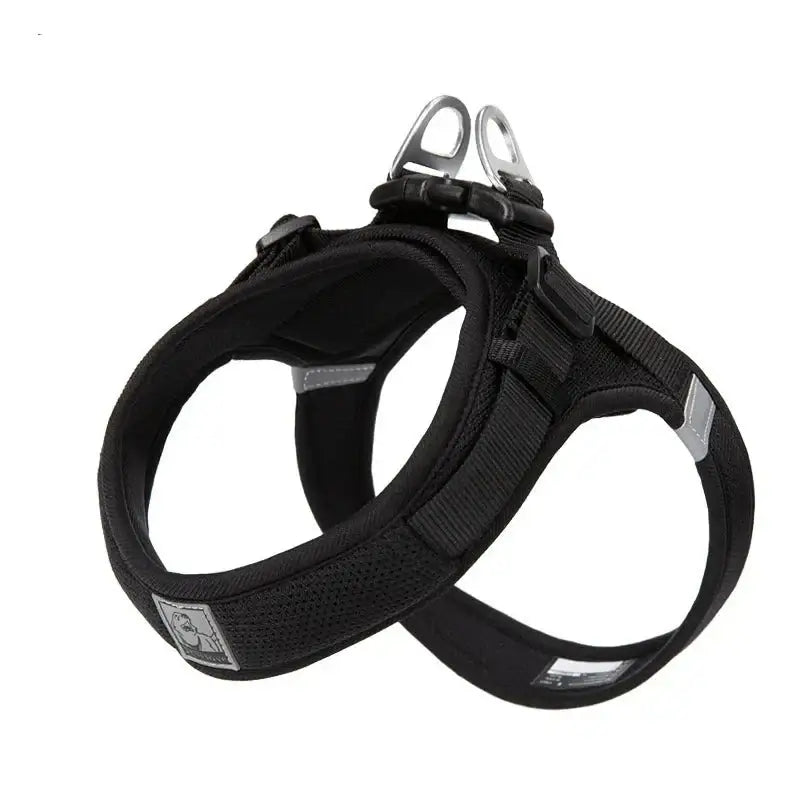 Black padded dog harness with metal attachment ring.