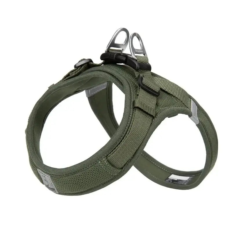 Dog harness in olive green color with adjustable straps and metal attachment rings.