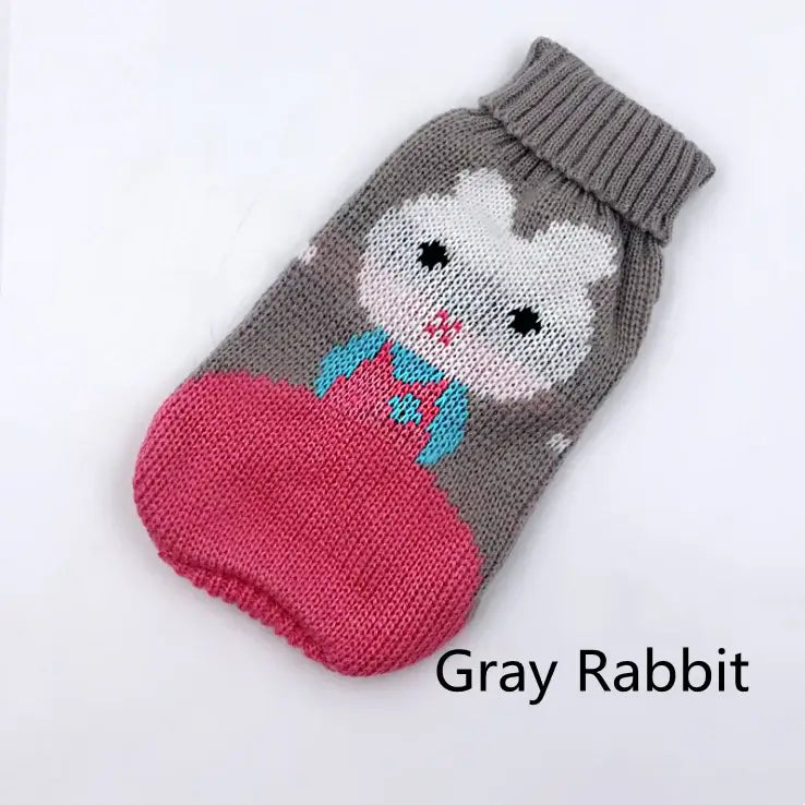 Knitted dog sweater with a gray rabbit design and pink bottom.