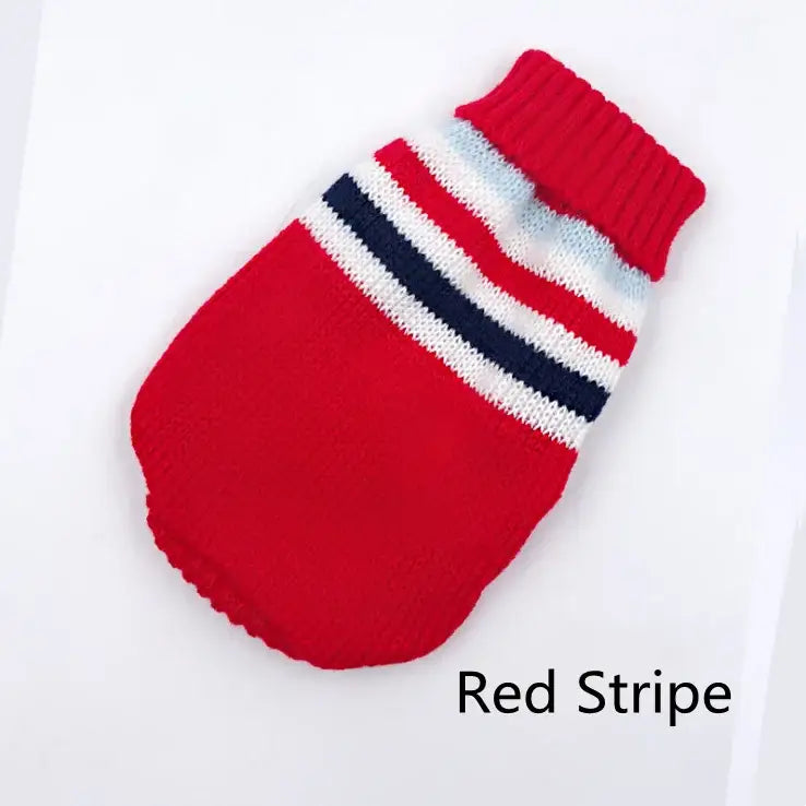 Red knitted dog sweater with white and navy stripes near the neck.