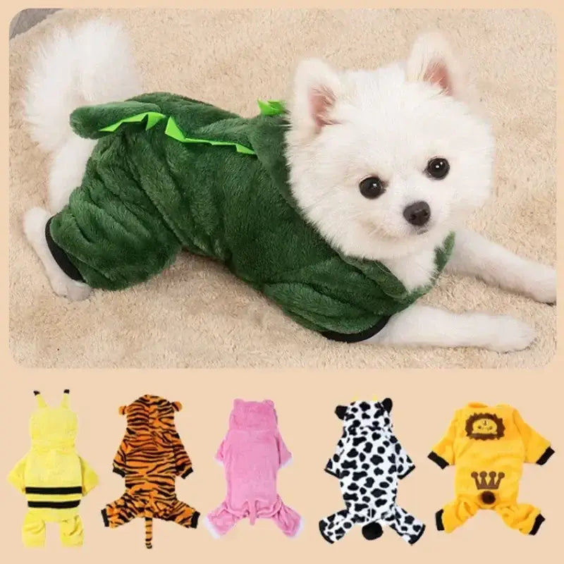 White fluffy dog wearing a green dinosaur costume.